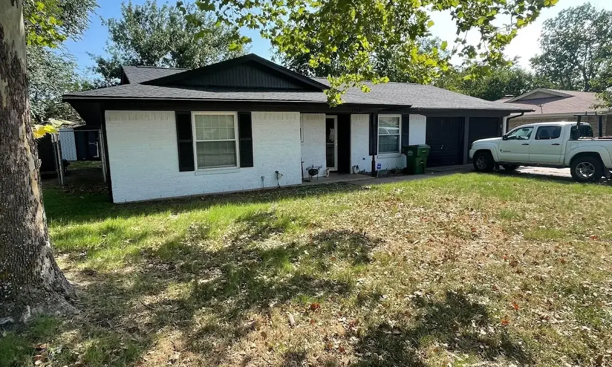 Professional roofing crew working on a residential roof in Portsmouth
